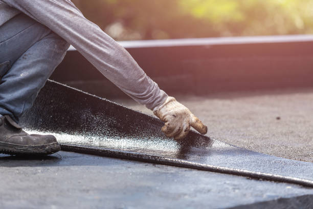 Professional Basement Waterproofing technician working in Lawrenceburg, KY